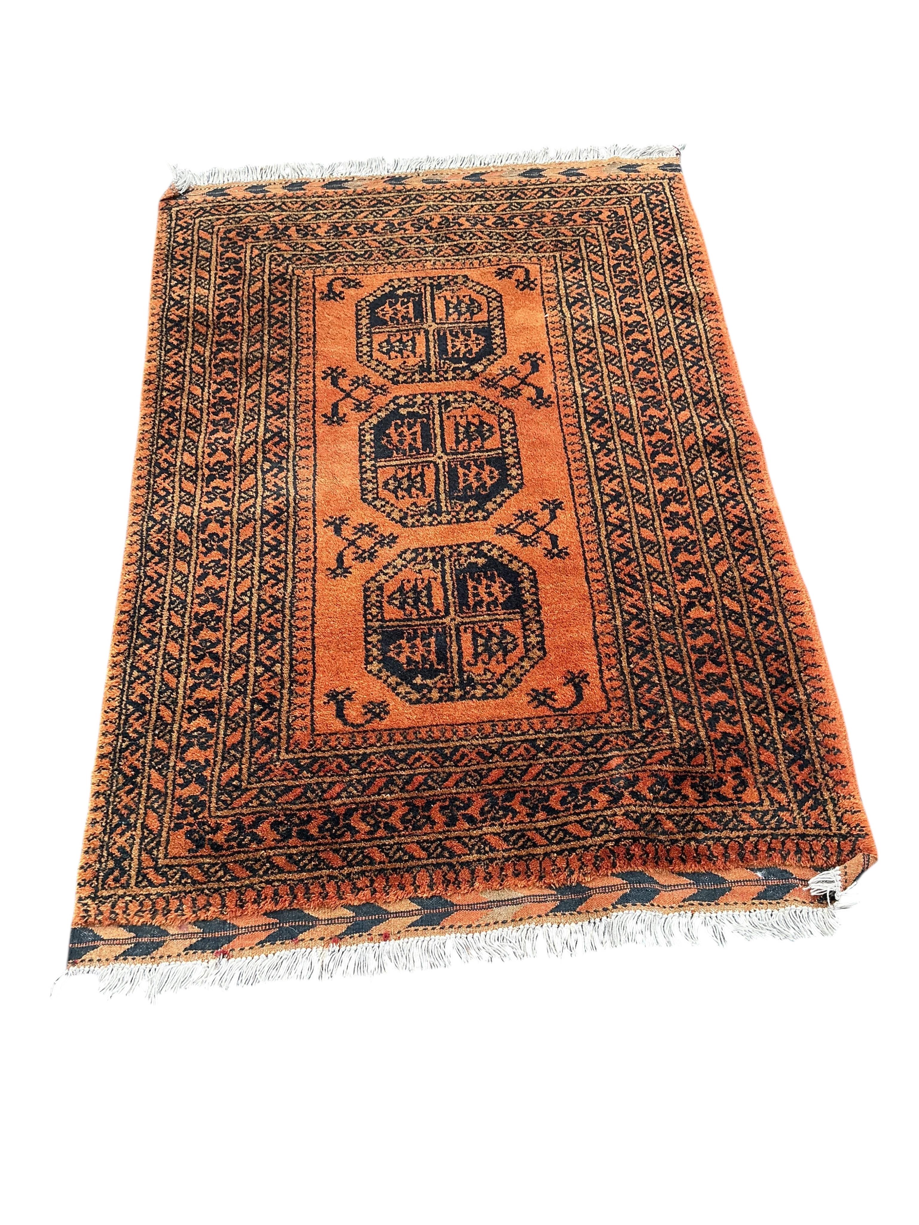 A Belouch red ground rug and an Afghan rug, 180 x 100cm and 155 x 105cm
